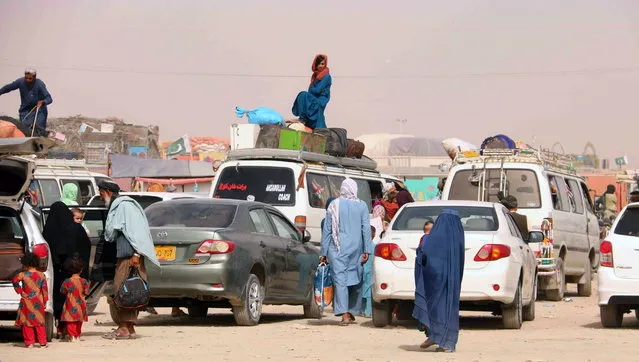 People arrive to go through checking as they prepare to cross into Afghanistan, at Chaman, Pakistan, 15 August 2021. Pakistani authorities reopened the border with Afghanistan on 13 August after several days of its closure. Taliban's shadow governor for Kandahar province had on 05 August issued a statement that announced the closing down of the border with Pakistan at Chaman, and said Islamabad should relax rules for crossing the frontier. (Photo by Akhter Gulfam/EPA/EFE/Rex Features/Shutterstock)