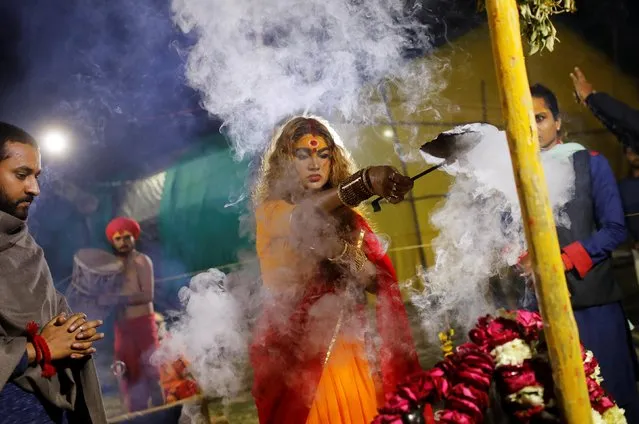 A member of the “Kinnar Akhara”, congregation for transgender people, prays inside their camp at “Kumbh Mela”, or the Pitcher Festival, in Prayagraj, previously known as Allahabad, India, February 2, 2019. (Photo by Anushree Fadnavis/Reuters)