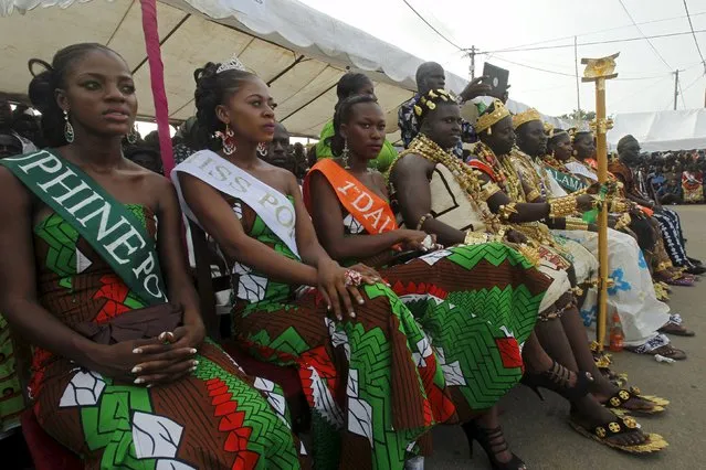 Miss Popo Carnival Yobo Zena Marie Lorraine (2nd L) sits with other candidates during a parade at the Popo (Mask) Carnival of Bonoua, in the east of Abidjan, April 18, 2015. (Photo by Luc Gnago/Reuters)