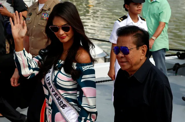 Filipino tycoon Luis “Chavit” Singson escorts Miss Universe Pia Wurtzbach at the Philippine Navy in Manila, Philippines January 19, 2017. Luis Singson, a larger-than-life Filipino tycoon who has brought the Miss Universe pageant to Manila, has much in common with the man who owned the franchise two years ago: U.S. President Donald J. Trump. Both men are immensely wealthy and are immersed in politics. Both have a cologne named after them. And, in their own countries, both are synonymous with a globally televised beauty contest that has often been buffeted by politics. (Photo by Erik De Castro/Reuters)