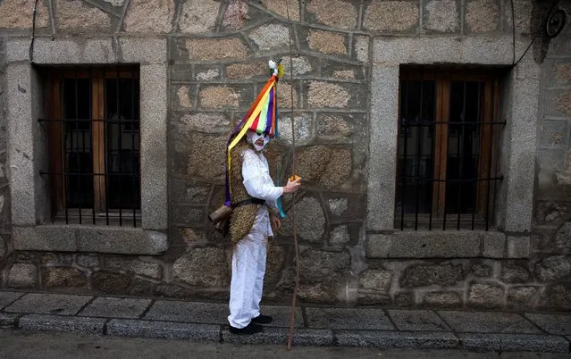 A reveller, dressed as “Zarramache”, poses during celebrations to mark Saint Blaise's festivity in Casavieja, Spain February 3, 2017. (Photo by Sergio Perez/Reuters)