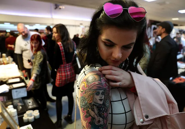 Michelle Keenan shows off her new mad hatter design at the Scottish Tattoo Convention in Edinburgh, Scotland on March 31, 2019. (Photo by Andrew Milligan/PA Wire Press Association)