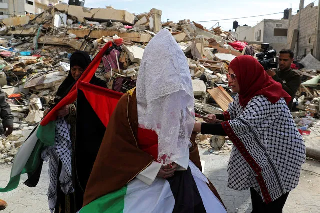 Palestinian bride Shayma Al-Huwaity, 20, is seen near her family house that was damaged recently in an Israeli air strike on a nearby Hamas site, on her wedding day in Gaza City on April 5, 2019. (Photo by Mohammed Salem/Reuters)