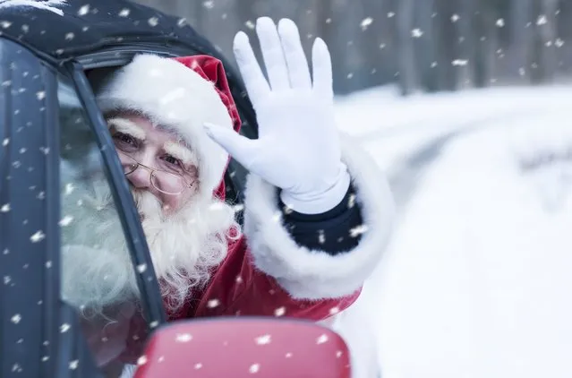 Santa Claus at car. (Photo by Vesnaandjic/iStock via Getty Images)