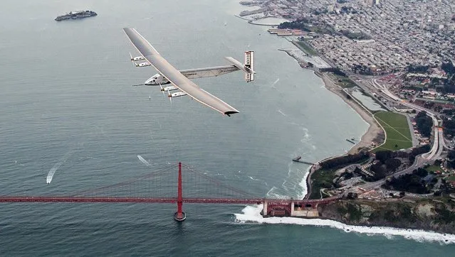 Solar Impulse 2 flies over the Golden Gate Bridge in San Francisco, Saturday, April 23, 2016. (Photo by Noah Berger/AP Photo)