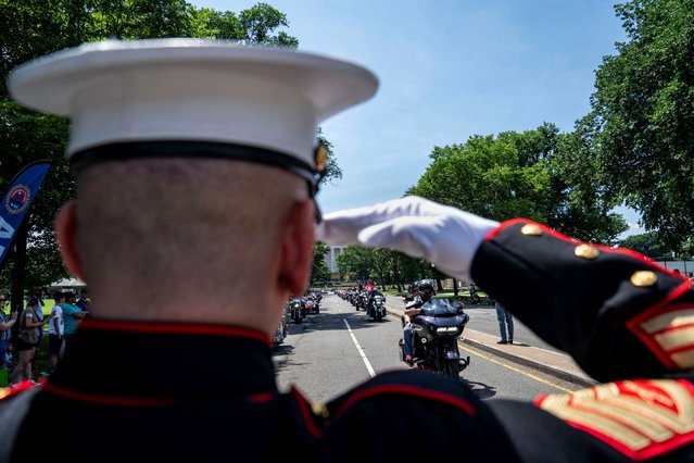 Tim Chambers “The Saluting Marine” salutes during the “Rolling to Remember” motorcycle rally, successor to “Rolling Thunder”, which rides through Washington to bring attention to issues faced by veterans, in Washington on May 26, 2024. (Photo by Bonnie Cash/Reuters)