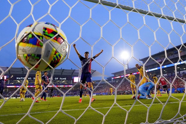 FC Dallas forward Petar Musa, center, reacts after a shot by teammate Asier Illarramendi entered the net of Real Salt Lake goalkeeper Zac MacMath, bottom right, for a goal during the first half of an MLS soccer match, Saturday, May 25, 2024, in Frisco, Texas. (Photo by Julio Cortez/AP Photo)