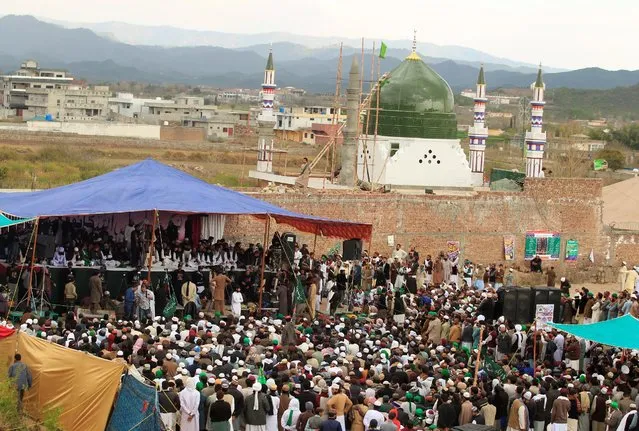 People attend a gathering to mark the anniversary of Mumtaz Qadri death next to the shrine built over his grave outside Islamabad, Pakistan, March 1, 2017. (Photo by Faisal Mahmood/Reuters)