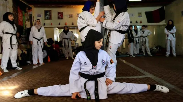 Afghan girls get taekwondo training at a location in Kabul, Afghanistan, 20 January 2022 (issued 25 January 2022). The Taliban's ban on female sports has forced a group of Afghan women from the national taekwondo team to go underground.The situation has not weakened the morale of the team members as they are accustomed to going against the tide in a conservative Afghan society that seeks to relegate them to the home. Bashir Ahmad Rustamzai, the country's new sports minister, has said the Taliban would permit 400 sports, but he wouldn't specify whether women could participate in any of them. (Photo by EPA/EFE/Stringer)