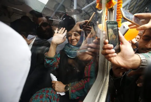 Chief minister of Indian Kashmir, Mehbooba Mufti waves as she takes a train journey after the launch of a new train service in Anantnag, around 50 kilometers south of Srinagar, the summer capital of Indian Kashmir, 05 May 2016. Indian Railways launched two new Diesel Electric Multiple Unit (DEMU) trains in Indian Kashmir, which would cut down travel time on the 135-kilometer track between Banihal in south Kashmir to Baramulla in north Kashmir. (Photo by Farooq Khan/EPA)