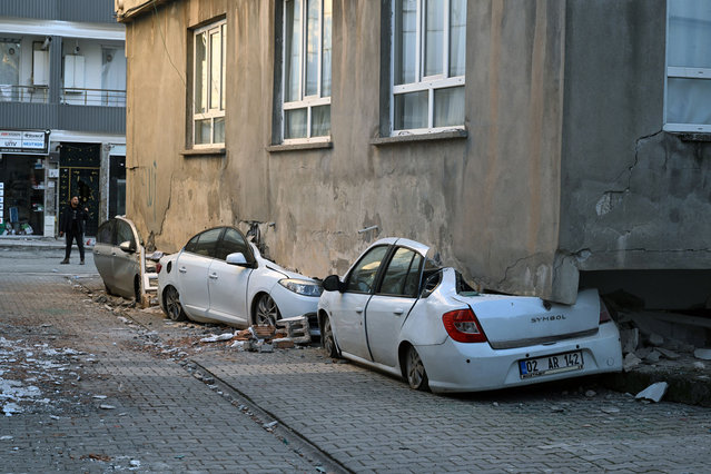 A building collapsed on parked vehicles after 7.7 and 7.6 magnitude earthquakes hit multiple provinces of Turkiye including Adiyaman on February 12, 2023. On Monday, Feb.6 a strong 7.7 earthquake, centered in the Pazarcik district, jolted Kahramanmaras and strongly shook several provinces, including Gaziantep, Sanliurfa, Diyarbakir, Adana, Adiyaman, Malatya, Osmaniye, Hatay, and Kilis. On the same day at 13.24 p.m. (1024GMT), a 7.6 magnitude quake centered in Kahramanmaras' Elbistan district struck the region. (Photo by Ozkan Bilgin/Anadolu Agency via Getty Images)