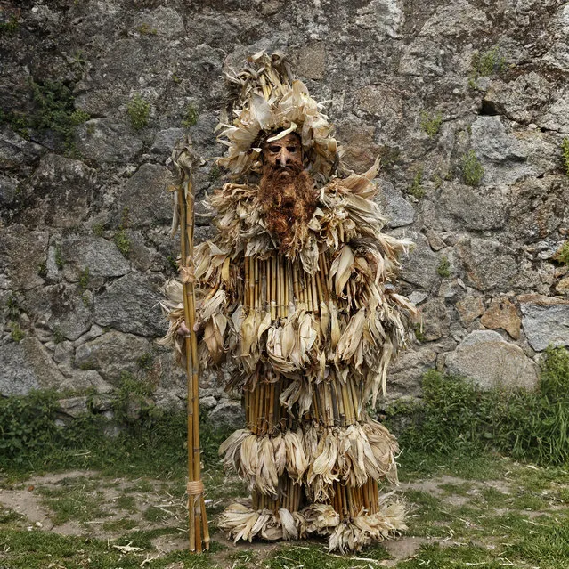 In this April 1, 2017 picture a man dressed as a “Trapajon” and representing a natural entity poses for a picture before a traditional Spanish mask gathering in the small village of Casavieja, Spain. (Photo by Daniel Ochoa de Olza/AP Photo)