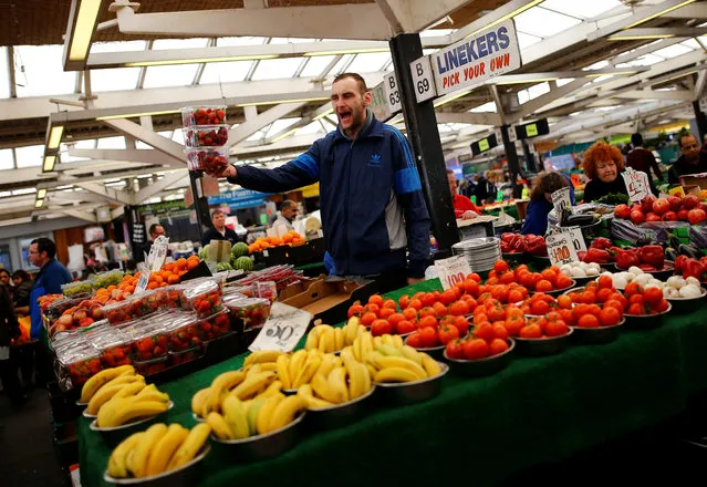 A worker sells strawberries on the market stall formerly owned by the parents of former Leicester City player Gary Lineker in Leicester, Britain April 20, 2016. (Photo by Darren Staples/Reuters)