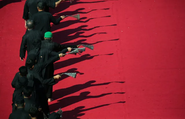 Shi'ite pilgrims flagellate themselves ahead of Ashura, the holiest day on the Shi'ite Muslim calendar in the holy city of Kerbala, Iraq, September 9, 2019. (Photo by Abdullah Dhiaa Al-Deen/Reuters)