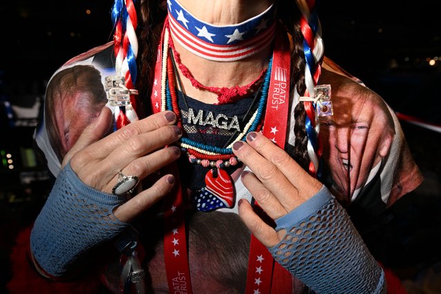 An attendee wears a MAGA necklace and shirt bearing the likeness of former president Donald Trump on the third night of the Republican National Convention on Wednesday, July 17, 2024 in Milwaukee. (Photo by Joshua Lott/The Washington Post)