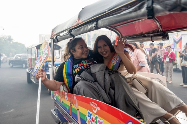 Members of the LGBTQ community celebrate after the Thai parliament passed the final senatorial vote on the same-s*x marriage bill, at Government House in Bangkok on June 18, 2024. Thailand on June 18 became the first country in Southeast Asia to legalise same-sеx marriage, in a historic parliamentary vote hailed as a “victory” by campaigners. (Photo by Chanakarn Laosarakham/AFP Photo)