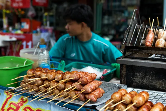 Grilled sausages and other meat snacks sit on display at a food stall in the Phaya Thai District of Bangkok, Thailand, on Wednesday, April 5, 2017. (Photo by Amanda Mustard/Bloomberg via Getty Images)