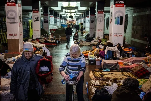 People take shelter and live in an underground metro station in Kharkiv, eastern Ukraine, on April 30, 2022. (Photo by Dimitar Dilkoff/AFP Photo)
