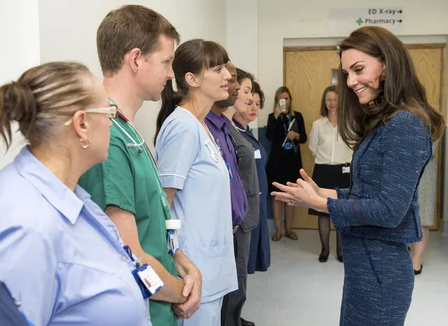 Britain's Kate, Duchess of Cambridge talks with hospital staff at King's College Hospital in London, Monday June 12, 2017, to meet staff and patients who were affected by the attacks in London Bridge and Borough Market on June 3. (Photo by Dominic Lipinski/Pool via AP Photo)