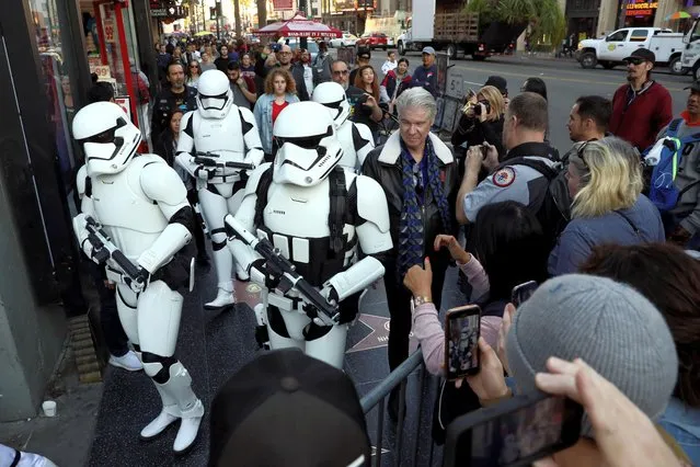 Star Wars fans in costume arrive for the first showing of “Star Wars: The Rise of Skywalker” at TCL Chinese theatre in Los Angeles, California, U.S., December 19, 2019. (Photo by Patrick T. Fallon/Reuters)