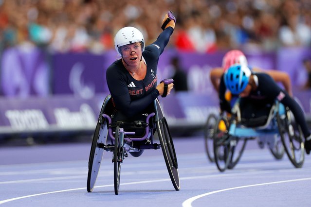 Hannah Cockroft of Team Great Britain celebrates after winning the gold medal in the Women's 100m T34 on day Four of the Paris 2024 Summer Paralympic Games at Stade de France on September 01, 2024 in Paris, France. (Photo by Tom Jenkins/The Guardian)