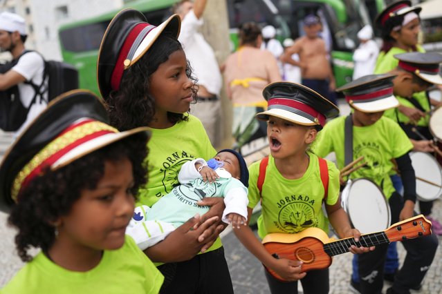 Youth participate in a Defense of Religious Freedom march at Copacabana beach in Rio de Janeiro, Sunday, September 15, 2024. The march seeks to bring attention to religious intolerance in the country. (Photo by Silvia Izquierdo/AP Photo)