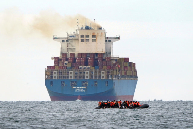 A group of people thought to be migrants crossing the Channel in a small boat traveling from the coast of France and heading in the direction of Dover, Kent on Tuesday, August 29, 2023. (Photo by Gareth Fuller/PA Images via Getty Images)