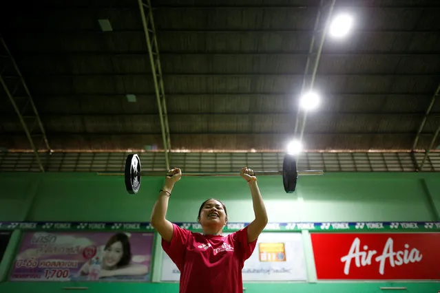 Thailand's badminton player Ratchanok Intanon, who hopes to win gold at the Rio Olympics, lifts weights during a training session at a gym in Bangkok, Thailand, June 22, 2016. (Photo by Athit Perawongmetha/Reuters)