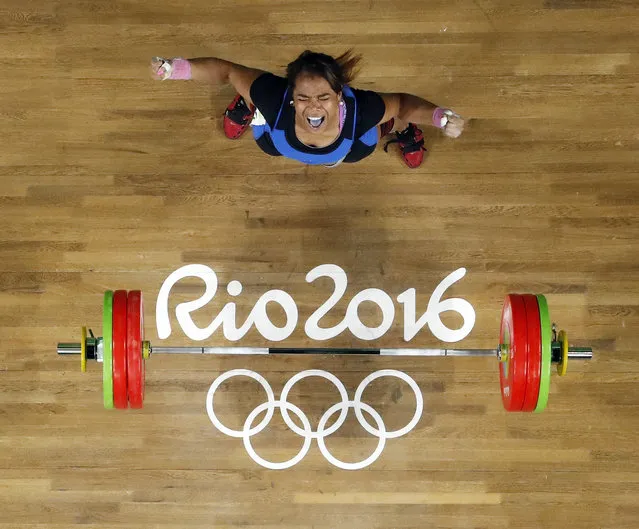 Leidy Yessenia Solis Arboleda, of Colombia, celebrates after a lift in the women's 69kg weightlifting competition at the 2016 Summer Olympics in Rio de Janeiro, Brazil, Wednesday, August 10, 2016. (Photo by Morry Gash/AP Photo)