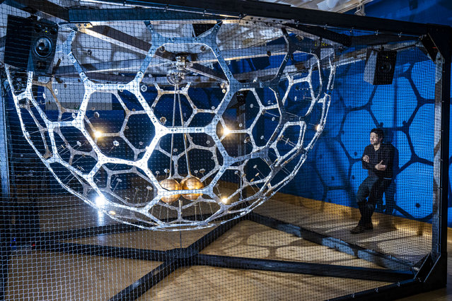 Artist Conrad Shawcross poses with his artwork, Ringdown, which forms part of “Cosmic Titans”, a joint exhibition between the University of Nottingham's Lakeside Arts venue and its physics department, exploring the links between science and art, which opens on Saturday, January 25, 2025. Ringdown is an analogy of a black hole collision. Two spheres are spun bronze bellls with microphones inside that record their resonance and eventual collision. Analogous to the gravitational waves created when black holes merge. (Photo by James Glossop/The Times & Sunday Times)