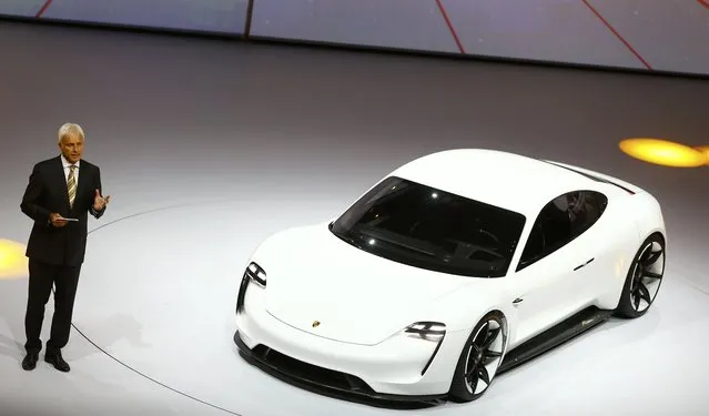 Porsche CEO Matthias Mueller presents the new electric Porsche Mission E concept car during the Volkswagen group night ahead of the Frankfurt Motor Show (IAA) in Frankfurt, Germany, September 14, 2015. (Photo by Kai Pfaffenbach/Reuters)