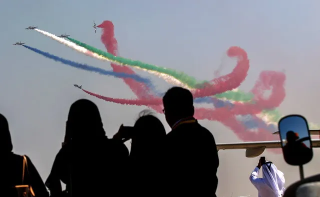Members of Al Fursan aerobatics demonstration team of the United Arab Emirates (UAE) perform during Abu Dhabi Air Expo 2022 at Al Bateen Executive Airport in Abu Dhabi, United Arab Emirates, 01 November 2022. Abu Dhabi Air Expo 2022 is running till 03 November 2022 where leaders and aviation experts from 45 countries are gathering to showcase the latest developments, technology and equipment in general aviation. (Photo by Ali Haider/EPA/EFE)