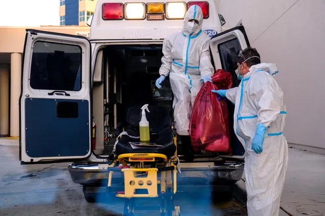 EMTs cleanse their materials outside Memorial West Hospital where coronavirus patients are treated, in Pembroke Pines, Florida, July 13, 2020. (Photo by Maria Alejandra Cardona/Reuters)
