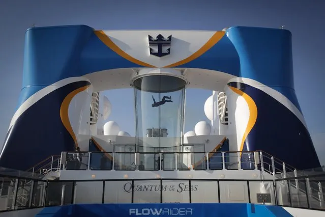 People use the skydiving simulator onboard the cruise ship Quantum of the Seas which is currently docked at Southampton on October 31, 2014 in Southampton, England. (Photo by Matt Cardy/Getty Images)