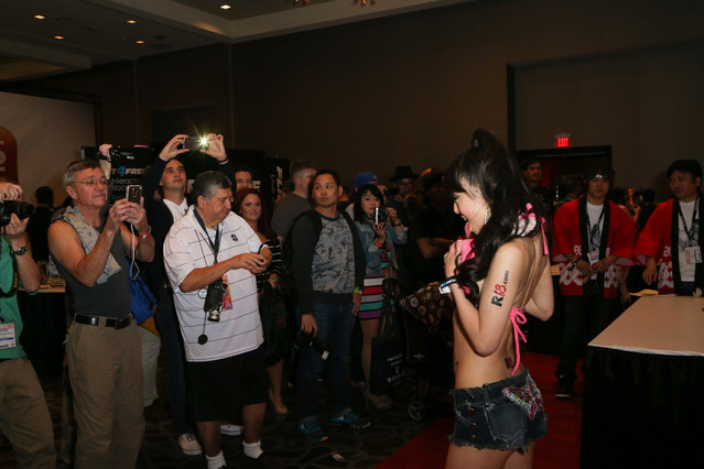 Adult film actress Hitomi Tanaka poses for fans during the 2015 AVN Adult Entertainment Expo at the Hard Rock Hotel & Casino on January 22, 2015 in Las Vegas, Nevada. (Photo by Gabe Ginsberg/FilmMagic)