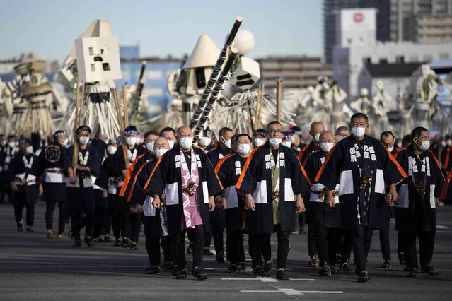 Members of a traditional firefighting preservation group march during the annual New Year's Fire Brigade Review Friday, January 6, 2023, in Tokyo. (Photo by Eugene Hoshiko/AP Photo)