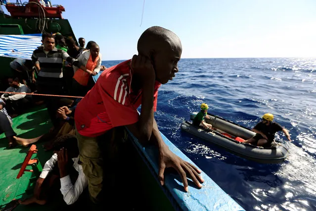 A migrant is seen onboard of Iuventa vessel after he was rescued from an overcrowded dinghy by members of the German NGO Jugend Rettet during an operation, off the Libyan coast in the Mediterranean Sea September 21, 2016. (Photo by Zohra Bensemra/Reuters)