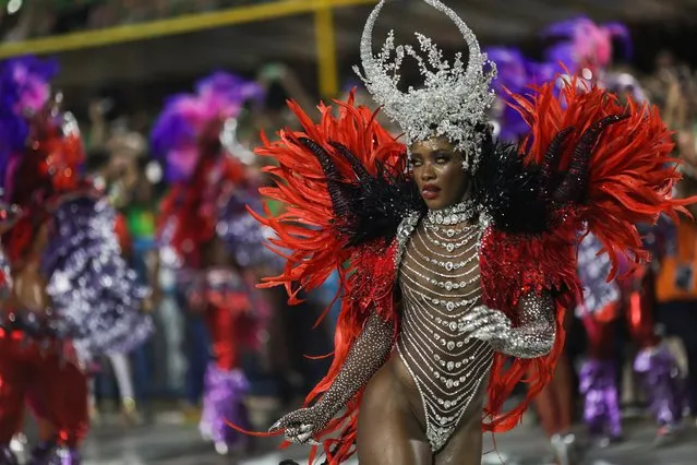 Drum queen Erika Januza from the Viradouro samba school performs during the second night of the carnival parade at the Sambadrome, in Rio de Janeiro, Brazil on February 21, 2023. (Photo by Ricardo Moraes/Reuters)