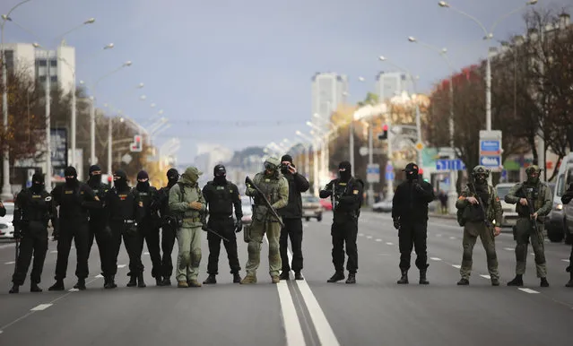 Belarusian police block a street during an opposition rally to protest the official presidential election results in Minsk, Belarus, Sunday, November 1, 2020. Nearly three months after Belarus’ authoritarian president’s re-election to a sixth term in a vote widely seen as rigged, the continuing rallies have cast an unprecedented challenge to his 26-year rule. (Photo by AP Photo/Stringer)