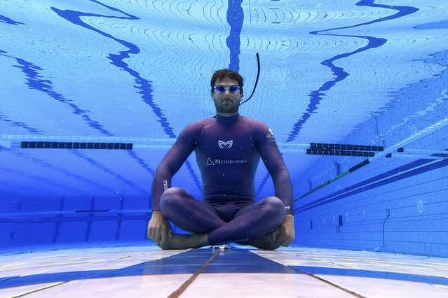 Croatian free diver Vitomir Maricic, 40, relaxes under water during a training at the pool in Rijeka, on October 14, 2025. Croatian freediver Vitomir Maricic went beyond what seemed impossible for the human body by holding his breath for an astonishing 29 minutes and three seconds under water. (Photo by Damir Sencar/AFP Photo)