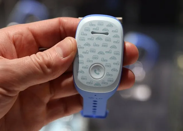 The LG GizmoPal, a connected wearable for kids, is displayed January 6, 2015 at the Consumer Electronics Show in Las Vegas, Nevada. The single button GizmoPal is a phone and GPS tracker allows kids to call only two registered numbers and receive calls from only four numbers phone numbers. The GizmoPal comes in pink and blue and sells for USD $80. (Photo by Robyn Beck/AFP Photo)
