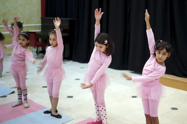 Palestinian girls take part in a ballet dancing course, run by the Al-Qattan Center for Children, in Gaza City November 25, 2015. (Photo by Suhaib Salem/Reuters)