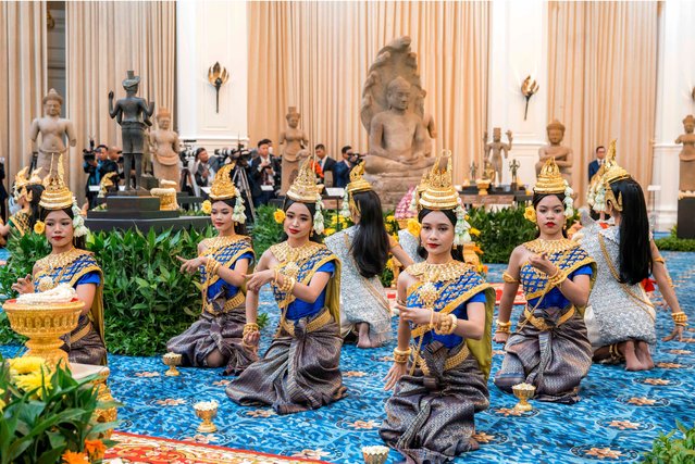 This pool photo taken and released on August 22, 2024 by Agence Kampuchea Presse (AKP) shows dancers performing in front of Khmer artefacts returned from the United States during a repatriation ceremony at the Peace Palace in Phnom Penh. Cambodia on August 22 welcomed the return of a batch of trafficked Buddhist and Hindu statues from collectors and museums in the United States. (Photo by AFP Photo/Stringer)