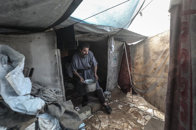 Palestinians struggle with flooding after heavy rain hits the Bureij Refugee Camp in Gaza City, Gaza on December 11, 2025.(Photo by Moiz Salhi/Anadolu via Getty Images)