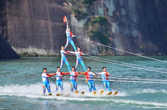 Participants give a performance on a river during a showcase at a tourism resort in Chenzhou, Hunan Province, China, November 6, 2016. (Photo by Reuters/Stringer)