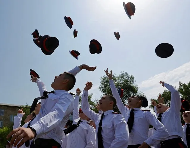 Cadets of the Luhansk Cadet School toss their caps during a graduation ceremony in Luhansk, Russian-controlled Ukraine on May 25, 2023. (Photo by Alexander Ermochenko/Reuters)
