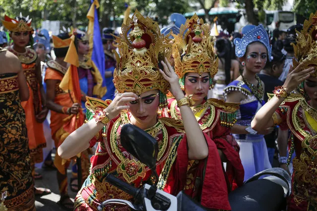 Balinese artists take parts during the cultural parade of the Bali Arts Festival in Denpasar, Bali, Indonesia on June 18, 2023. In order to preserve culture heritage and promote tourism, the annual festival will showcase diverse array of Balinese arts and traditional performances throughout the month. This event holds great significance as Indonesia enters the endemic stage of the Covid-19. (Photo by Johannes P. Christo/Anadolu Agency via Getty Images)