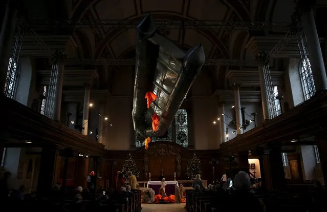 Artist Arabella Dorman's installation “Flight” is presented at the nave of St James's Church in London, Britain December 20, 2015. According to the artist, the work was created from a salvaged dingy and lifejackets from refugees in Lesbos, Greece. (Photo by Neil Hall/Reuters)
