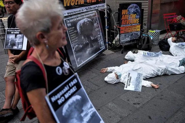 Anti-war demonstrators stage a die-in as they mark the 78th anniversary of the 1945 atomic bomb attack on Hiroshima with a march and protest at Times Square in New York, U.S., August 6, 2023. (Photo by Eduardo Munoz/Reuters)