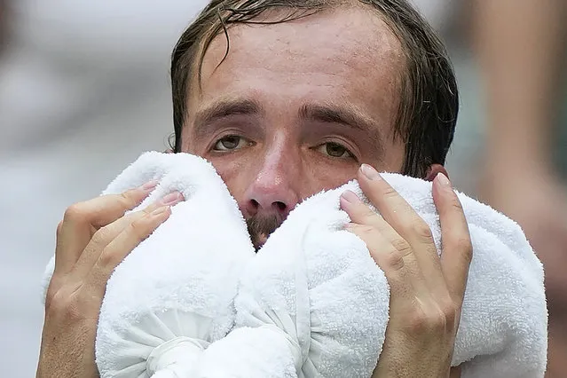 Daniil Medvedev, of Russia, cools off between games against Andrey Rublev, of Russia, during the quarterfinals of the U.S. Open tennis championships, Wednesday, September 6, 2023, in New York. (Photo by Seth Wenig/AP Photo)